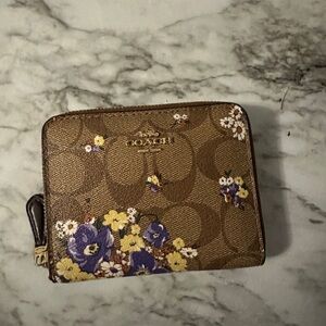 NWOT Coach small zip wallet in wildflower print.